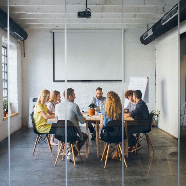 A business meeting in a modern boardroom at CA