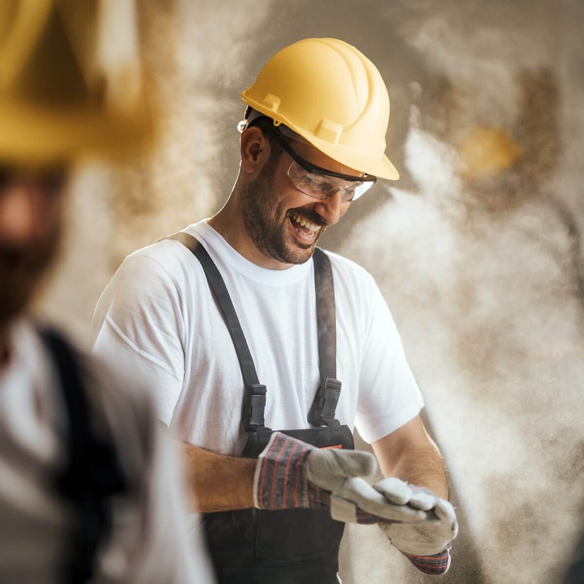 Workmen on site in hard hats training And Certifications